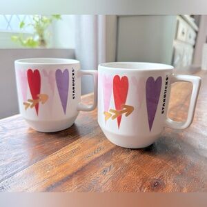 Set of 2 starbucks mugs with hearts.